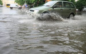 Car driving through flood water